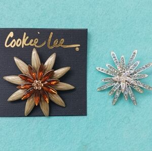 Two starbust style brooches. Over 2 inches at widest